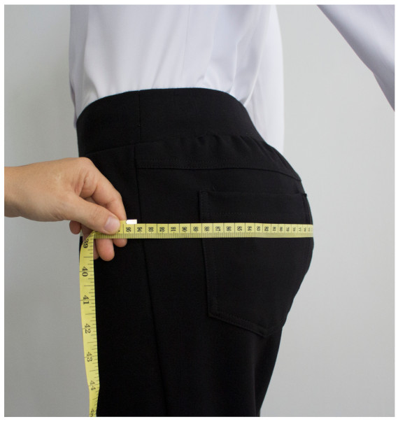 A person measuring their buttDescription automatically generated